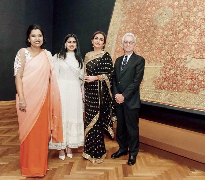 (From left) Madhuvanti Ghose (Alsdorf Associate Curator of Indian, Southeast Asian, Himalayan, and Islamic Art), Isha Ambani, Nita M Ambani (Founder and Chairperson, Reliance Foundation) and Douglas Druick (President and Eloise W. Martin Director, Art Institute, Chicago) pose in front of the Zardozi Pichvai of Vitthaleshji (mid-17th Century, Surat, Gujarat) at the exhibition