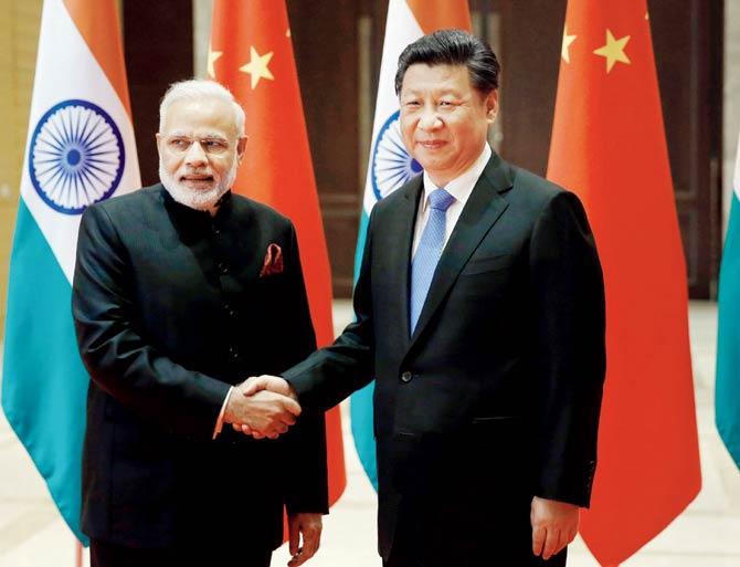 PM Narendra Modi and Chinese President Xi Jinping both are visiting the US at a time when they have important political preoccupations back home. FIle pic/AFP