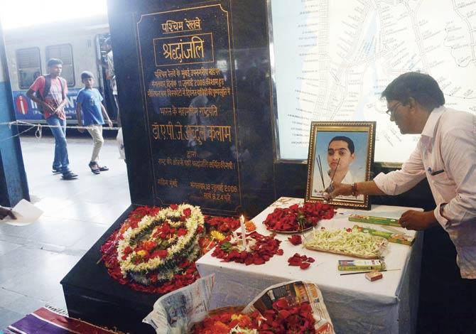 Parag Sawant’s photo placed near an 11/7 blasts memorial at Mahim station. Sawant breathed his last on July 7 this year. File pic