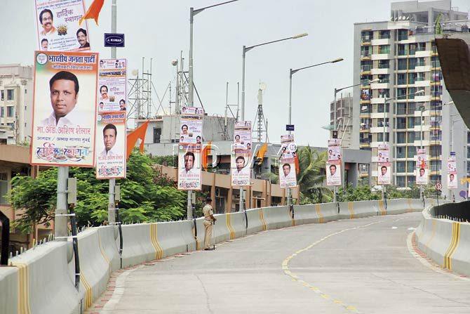 The entire flyover was covered with saffron flags and posters of Thackeray and BJP city president Ashish Shelar. Pic/Sharad Vegda