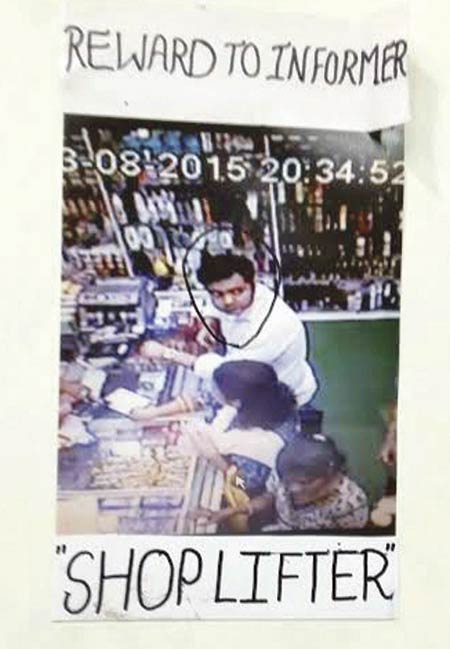 The poster inside the store offering a reward for information
