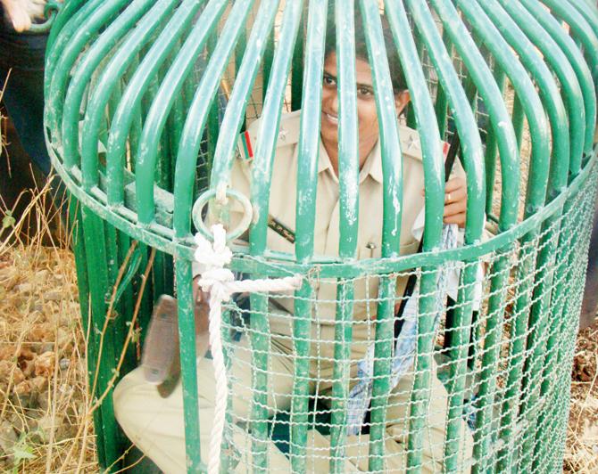 Rasila Vadher inside a cage used for rescue