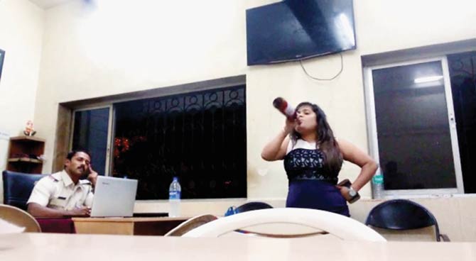 mid-day has copies of two of the videos recorded by the police officers, and she can be seen drinking from the beer bottle in both. In one of them, she can be heard saying, “Oye Madam Ji, Sunita Yadav. Haryana ki hoon main” (Madam, my name is Sunita Yadav. I’m from Haryana), before going on to threaten the cops of action being taken against them because she had contacts in the right places