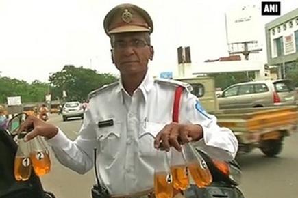 This traffic cop provides needy riders with petrol