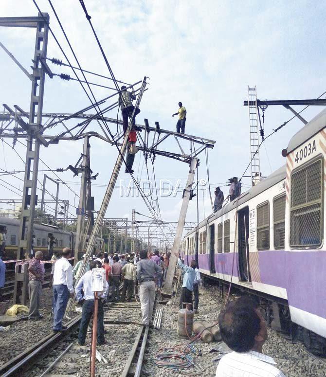 Railway employees busy repairing the damaged porter