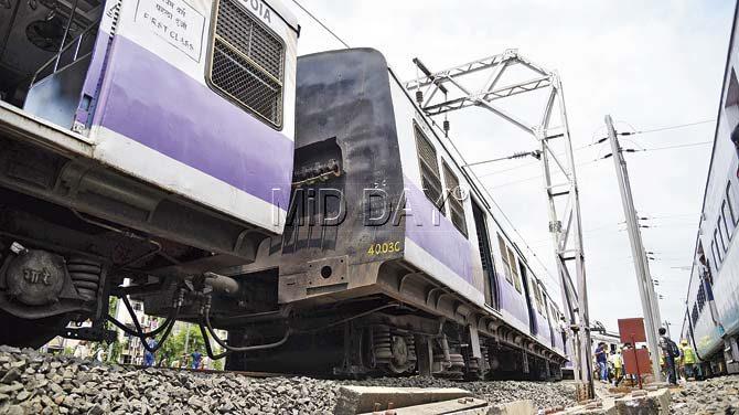 After the derailment, one of the seven coaches crashed into a 70-year-old porter — a metal frame that holds overhead cables supplying power to the trains — and damaged it. The impact of the collision was such that the entire frame was dented. Pics/Rane Ashish