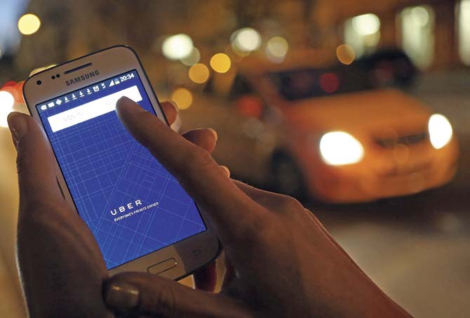 Uber released a revised set of terms and conditions on September 10, according to which the company is not responsible for anything that goes wrong during the cab ride. Representation pic/Getty Images