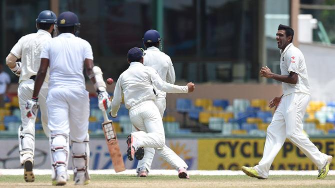 R Ashwin celebrates a wicket with his team