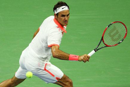 US Open: Roger Federer brushes aside Steve Darcis to reach third round