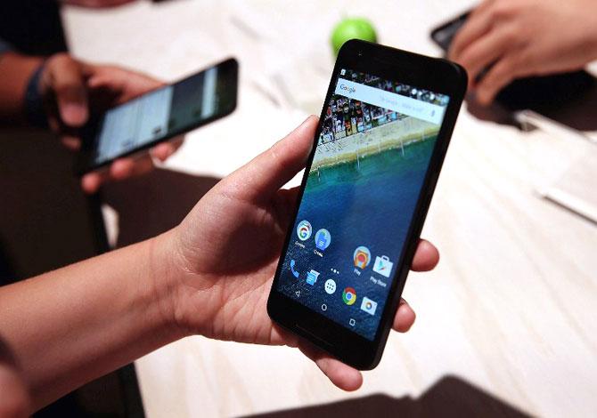 An attendee inspects the new Nexus 5X phone during a Google media event in San Francisco, California