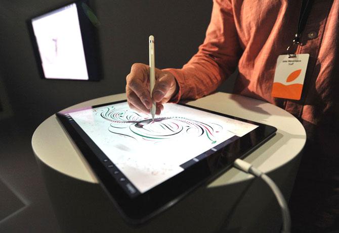An Apple employee demonstrates how to use the new Apple Pencil for the iPad Pro at a media event in San Francisco, California. AFP PHOTO/JOSH EDELSON