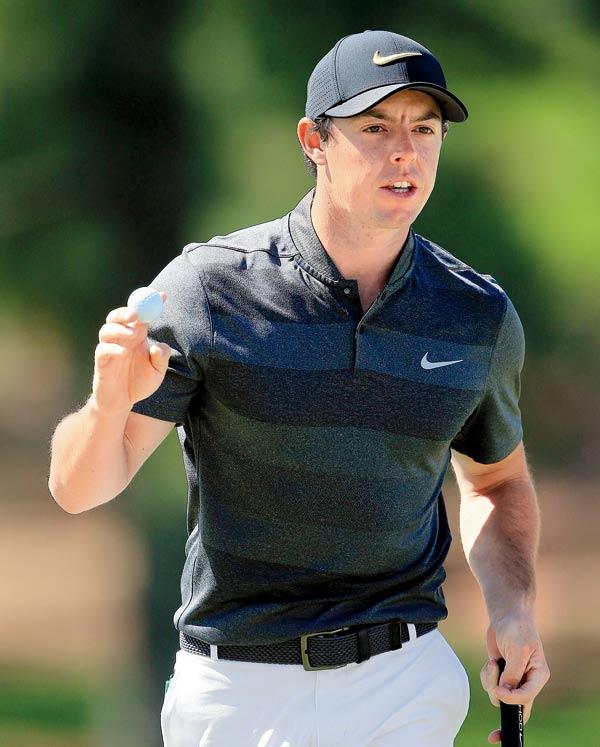Rory McIlroy celebrates a birdie on the seventh green