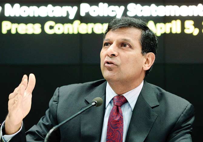 RBI governor Raghuram Rajan speaks to the press at the RBI headquarters in Mumbai after the RBI cut its key interest rate to a five-year low of 6.5 per cent. Pic/AFP