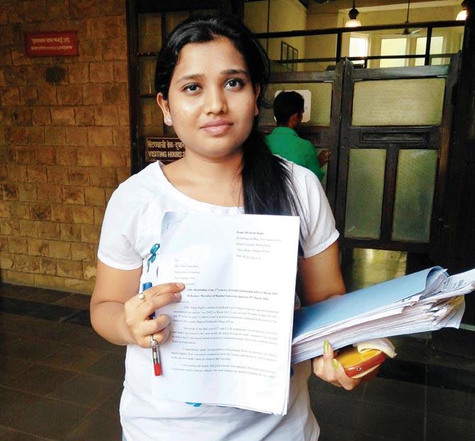 Swati Bagade with her grievance application at the Mumbai University’s Fort campus