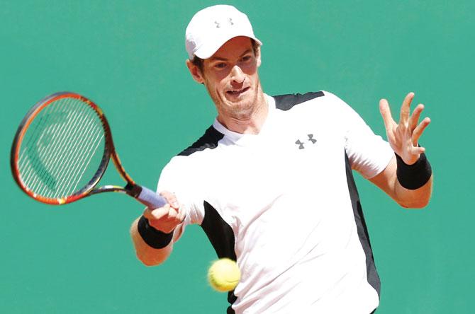 Andy Murray returns to Benoit Paire at the Monte Carlo Masters yesterday