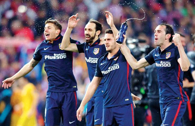 Atletico Madrid players celebrate their victory over Barcelona in the Champions League quarter-final second-leg match at the Vicente Calderon in Madrid on Wednesday. Pic/Getty Images