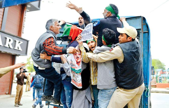 Indian police detain activists from the Jammu and Kashmir Libration Front (JKLF) during a protest in Srinagar on Friday. Pic/PTI