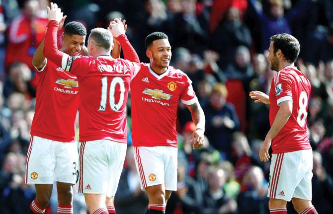 Man United striker Marcus Rashford (extreme left) celebrates his goal with teammates during their EPL match against Aston Villa in Manchester on Saturday. Pic/Getty Images