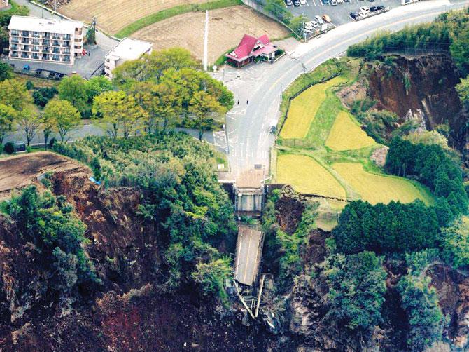 A bridge is cut off by landslides in Minamiaso, Kumamoto prefecture