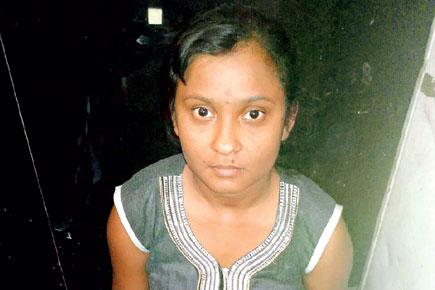 Woman studies for CA in Yerawada Central Jail
