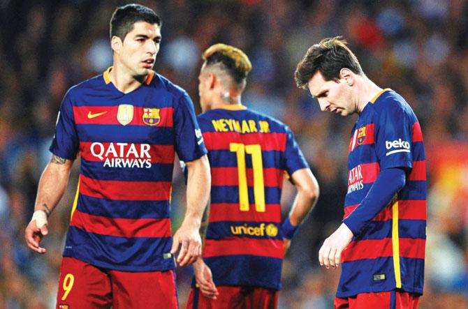 Barcelona striker Lionel Messi (right) sports a dejected look as teammate Luis Suarez looks on during the Spanish League match against Valencia at Camp Nou in Barcelona on Sunday. Pic/Getty Images