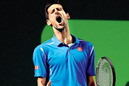 Miami Open: Novak Djokovic overcomes back spasms to reach semis
