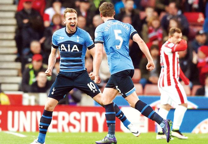Tottenham forward Harry Kane (left) celebrates with his teammate Jan Vertonghen after scoring a goal during the Premier League match against Stoke City at Britannia Stadium in Stoke on Monday. Pic/Getty Images 