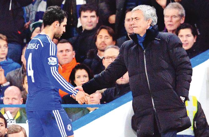 Chelsea manger Jose Mourinho (right) greets midfielder Cesc Fabregas during the EPL match against Tottenham Hotspur in London last year. Pic/AFP