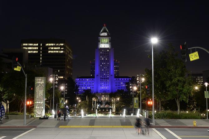 Los Angeles City Hall is lit up in purple in memory of musician Prince. Pic/ AFP