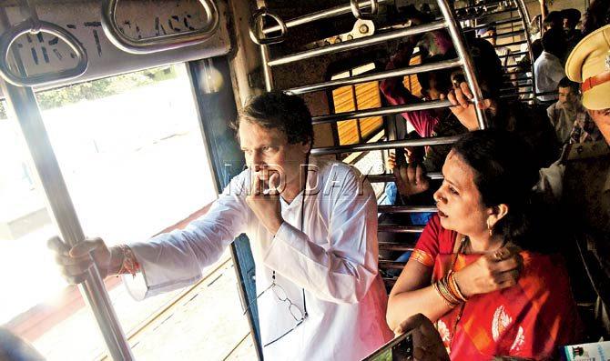Despite the chaos and constant chatter, Prabhu was leaning out of the coach and waving to people standing on the other platforms