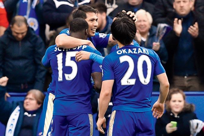 Leicester City striker Leonardo Ulloa (centre) celebrates a goal with teammates during the EPL match vs Swansea yesterday. pic/AFP