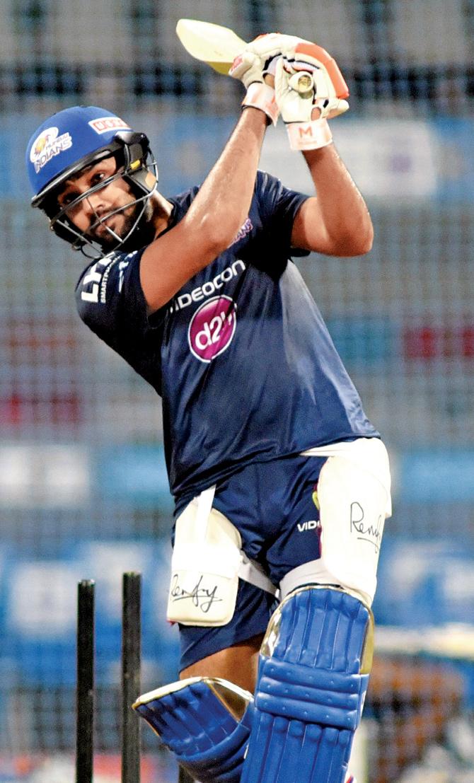 Mumbai Indians skipper Rohit Sharma bats in the nets on the eve of their clash against KKR at Wankhede yesterday. Pic/Atul Kamble