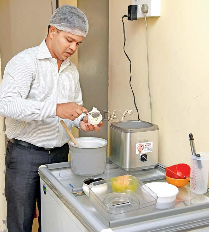 Co-founder Vivek Kashelkar prepares a fresh batch of dessicated coconut and jaggery ice cream at his apartment