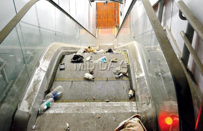Garbage litters the defunct escalator