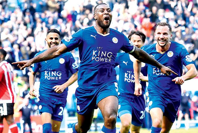 Leicester City defender Wes Morgan (centre) celebrates after scoring a goal during their English Premier League match against Southampton at King Power Stadium in Leicester, England yesterday. Pic/AFP
