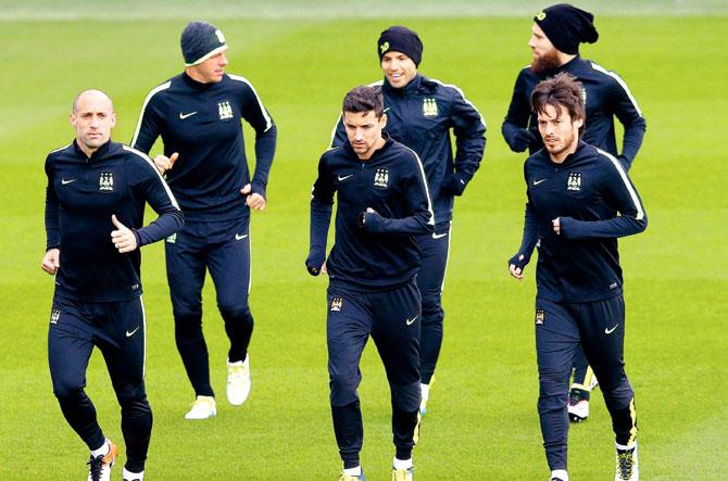 Manchester City players warm-up during a training session ahead of their Champions League QF first leg match against PSG. Pic/Getty Images
