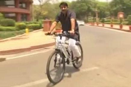 BJP MP Manoj Tiwari rides bicycle to Parliament