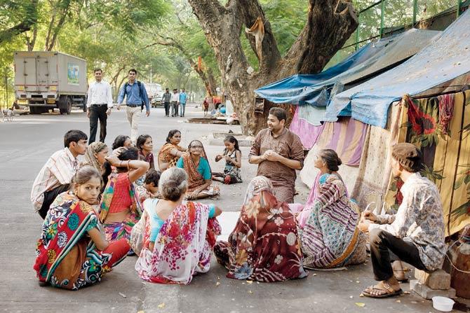 Brijesh Arya, founder of Pehchan, one of only a couple of NGOs working on homelessness in the city, meets with homeless women leaders