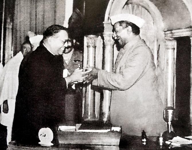 Dr Ambedkar, chairman of the Drafting Committtee, presenting the final draft of the Constitution to Dr Rajendra Prasad, then the chairman of the Constituent Assembly 