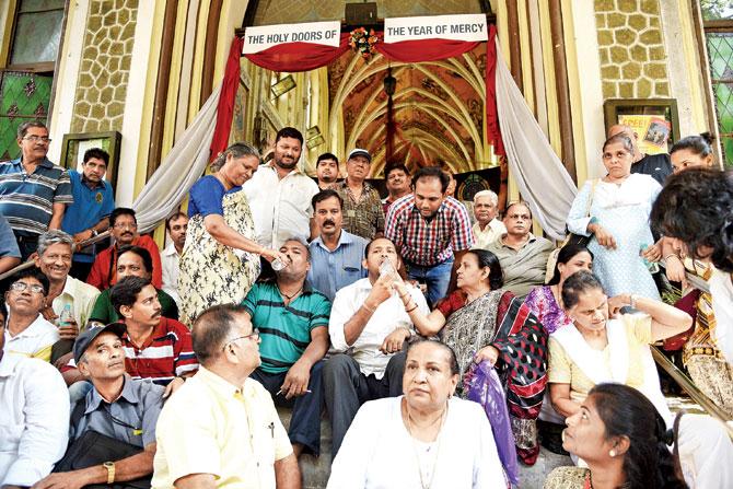 Rupesh Gomes (in white shirt) been fed by his mother Savitri and George Miranda (in green shirt) been fed by his mother Jessy as they break their 6-day fast outside the Archbishop’s house in Colaba. PIC/ SURESH KARKERA