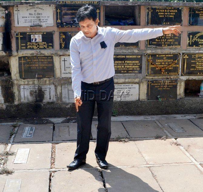 Sizing it up: Lawrence Fernandes, deanery counsellor for Bombay Catholic Sabha, shows the spot till where the BMC plans to acquire the cemetery.  Pics/Datta Kumbhar