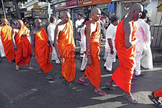 Monks march in the procession towards Ambedkar Bhavan where Raja and Radhika took deeksha. Pic/Atul Kamble