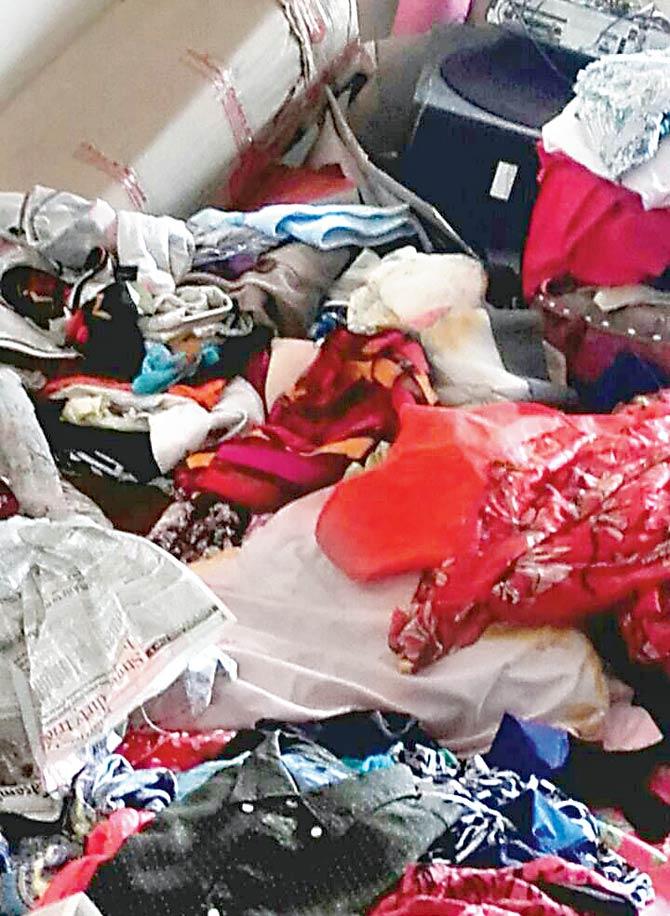 Cops found heaps of clothes strewn around the bedroom and liquor bottles and half-empty packets of snacks littered everywhere
