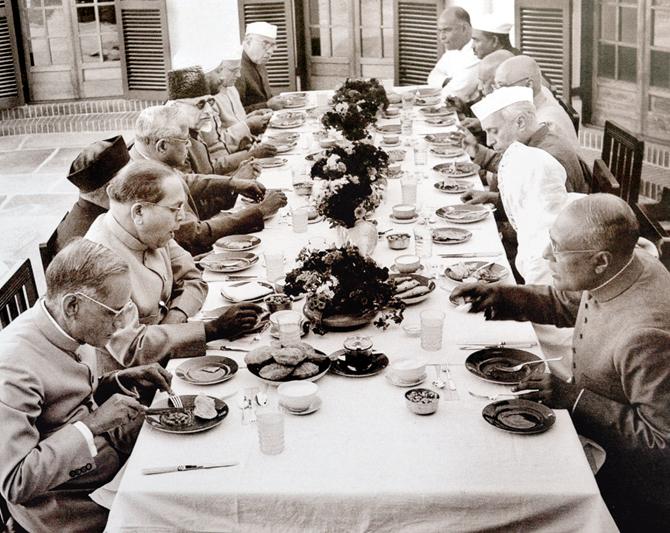 Prime Minister Jawaharlal Nehru with his cabinet, including  Dr Ambedkar, the then law minister, sitting down for a meal