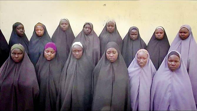 The video was supposedly shot on December 25, 2015. The footage, shown on CNN, is the first time any of the missing girls have been seen since a previous Boko Haram video in May 2014, when about 100 were seen in Islamic dress reciting the Quran. Pic/AFP