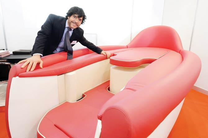 Mauro Cavagna shows his invention called “Desire”, a sofa designed to give greater comfort during intimate relationships, at the 44th International Exhibition of Inventions in Geneva