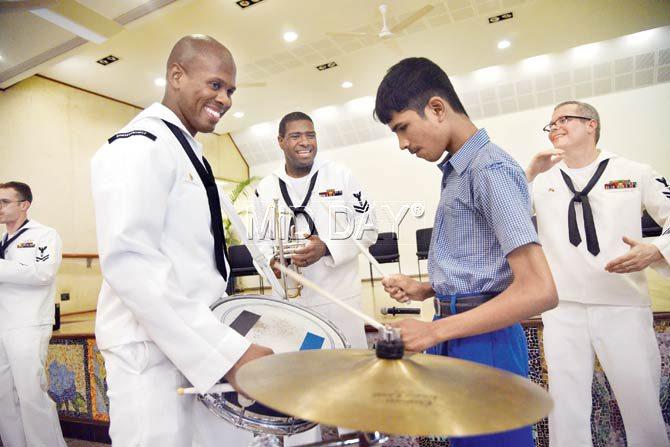 Members of the US Navy band interact with kids from the Happy Home School for the Blind. Pic/Suresh Karkera