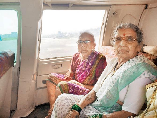 Vithabai (left) was flying for the first time in her life. (Right) Her daughter-in-law’s mother Shitabai (75)