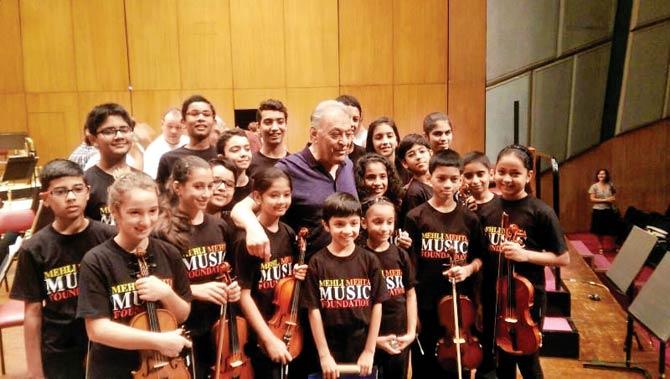 Zubin Mehta with young students of the Mehli Mehta Foundation School