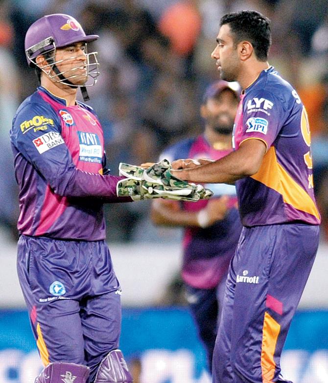 RPS’ spinner R Ashwin (right) celebrates the wicket of SRH’s Deepak Hooda with skipper MS Dhoni in Hyderabad on Tuesday. Pic/AFP